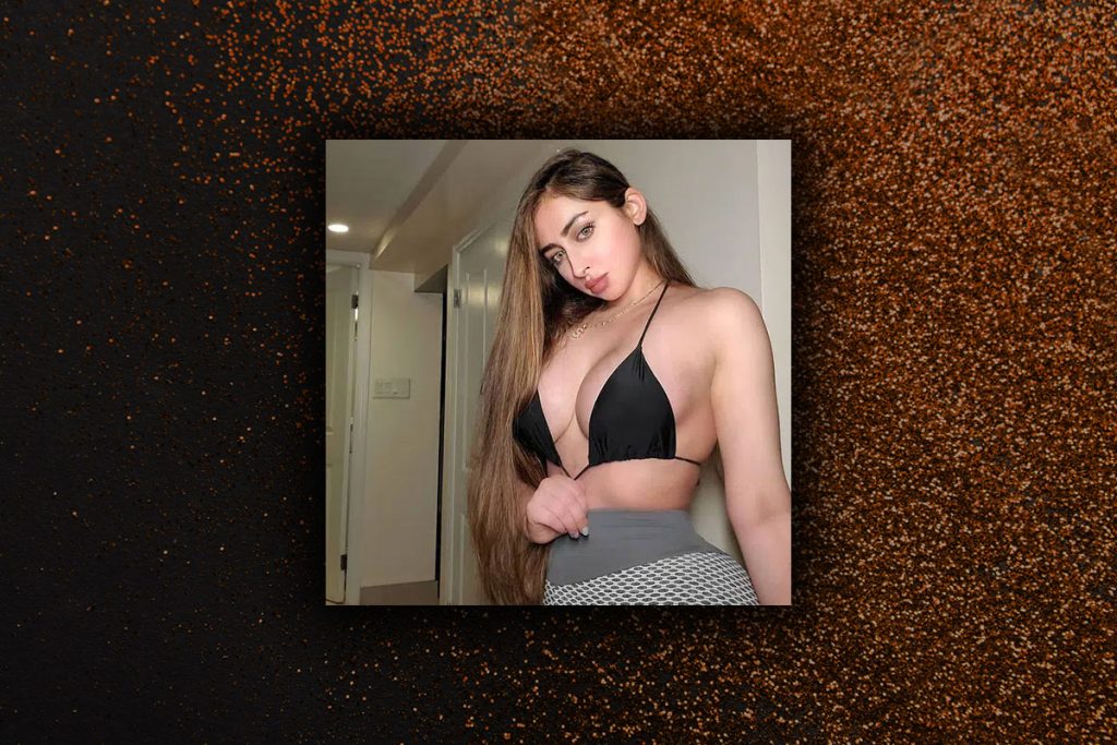 Xena posing for the camera, hotel rooms with strip pole