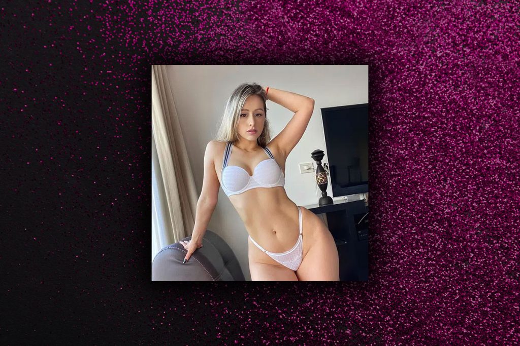 Zoey in white lingerie, ordering a stripper