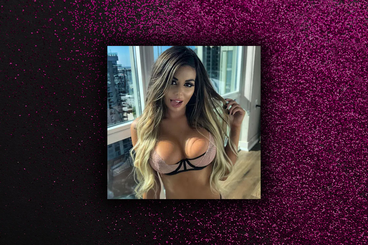 Brazil in a pink bra getting ready for a private lap dance